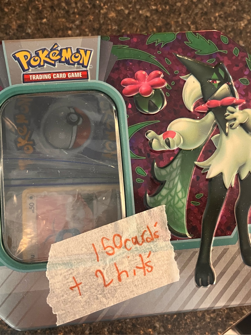 Pokemon Tin Featuring Sprigatito Artwork in Teal and Burgundy
